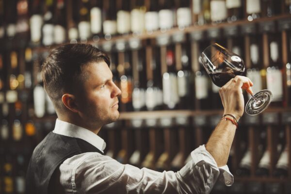 male-sommelier-tasting-red-wine-cellar-professional-expert-appreciates-quality-beverage