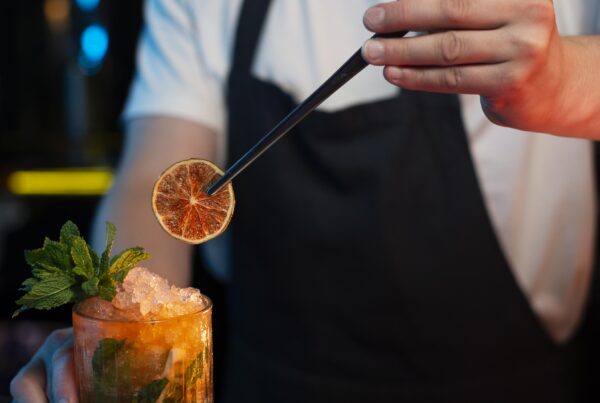 bartender-making-delicious-refreshing-cocktail